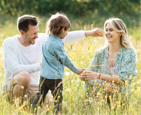 A happy family smiling after receiving dental care at Elite Dental & Wellness in Mesa, AZ